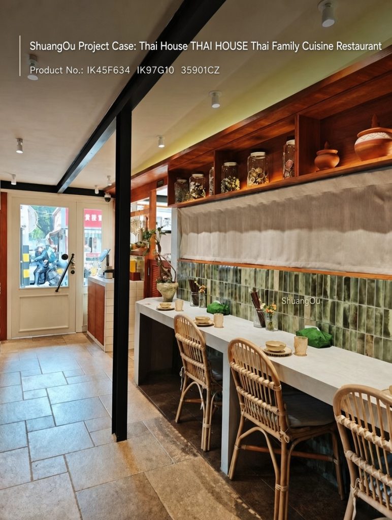 THAI HOUSE restaurant interior featuring ShuangOu Aurora Series green backsplash tiles (IK45F634, IK97G10) and Limestone Terracotta Castle Tile flooring (35901CZ) paired with rattan chairs.