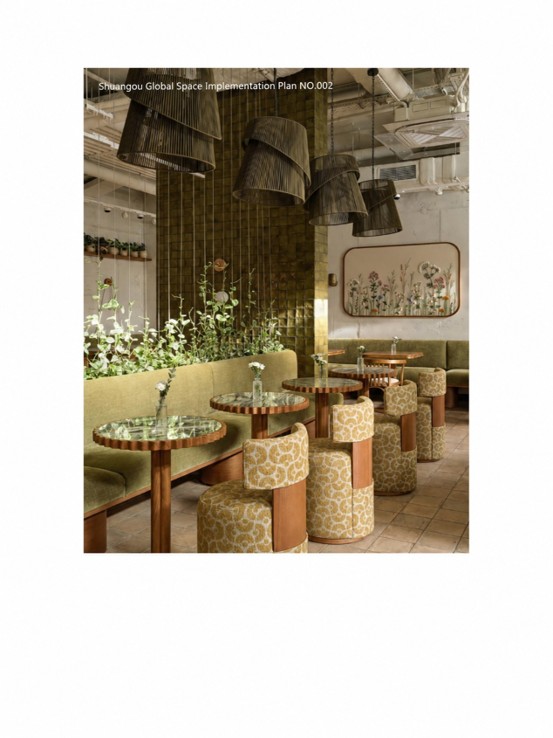 Begin Cafe dining area featuring olive-green glossy glazed wall tiles, patterned upholstered armchairs, wooden tables, woven pendant lights, and indoor greenery.